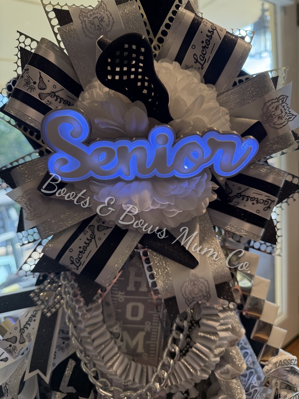 Senior garter with the name lit up in blue LED